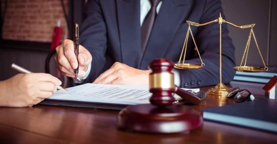 An attorney helping someone with a legal document