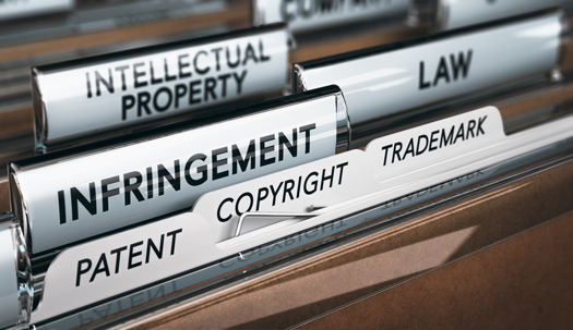 Hanging file folder tabs labeled Infringement, Intellectual Property, Patent, Copyright, and Trademark.